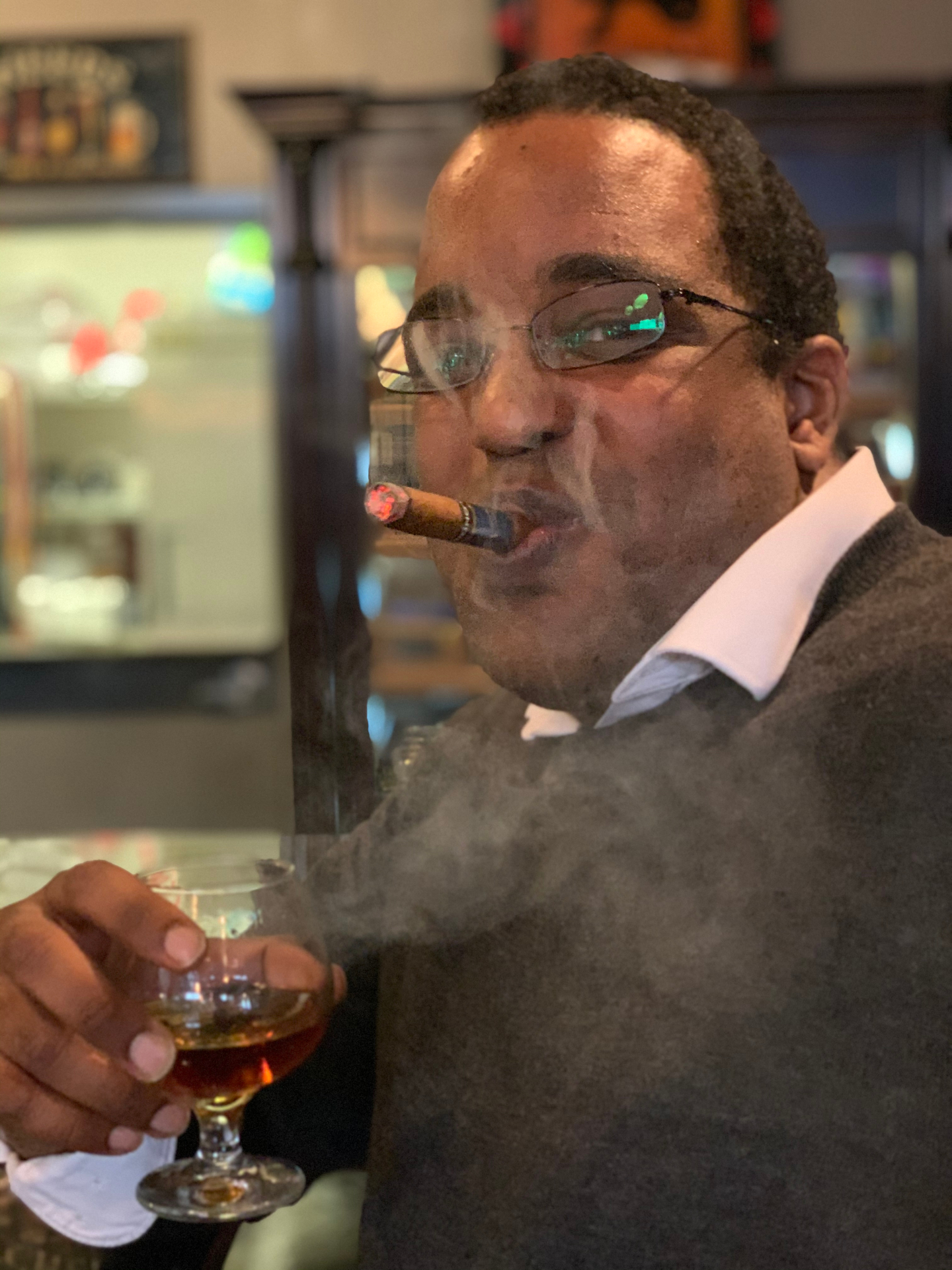 Ammanuel Santa Anna — in good lighting, with the cigar mostly held.
